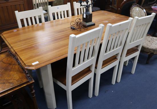 A painted pine kitchen table and six chairs, W.187cm